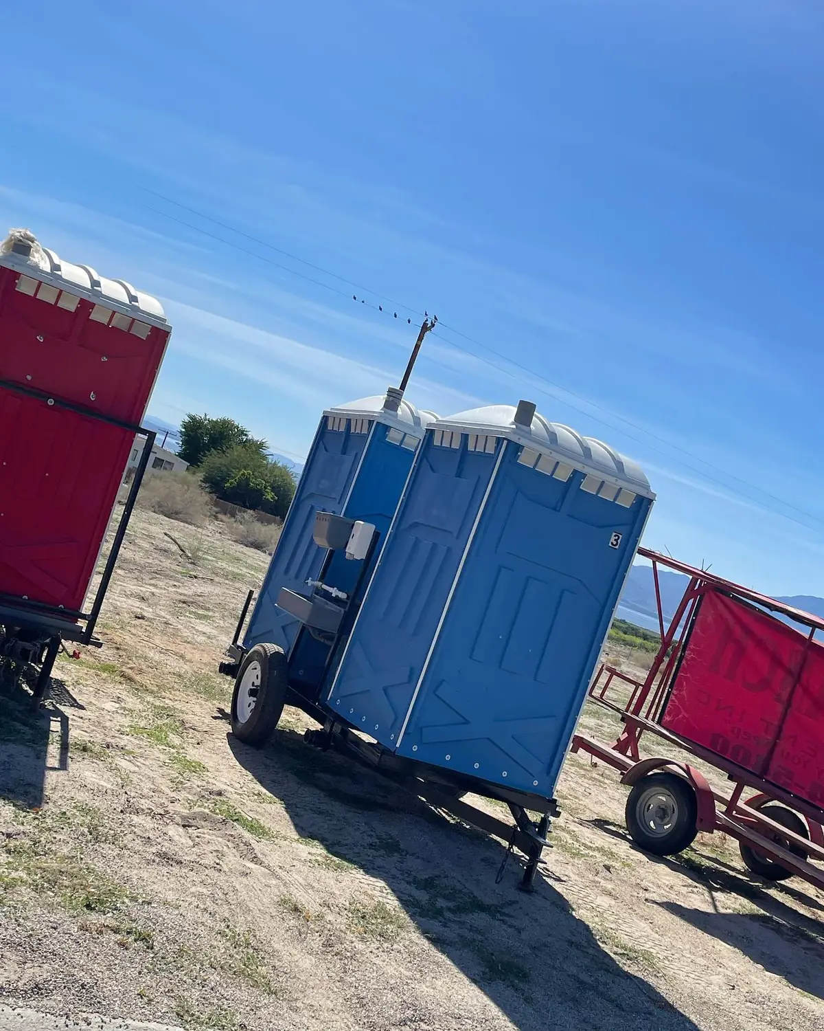 Portable toilets on a trailer ready for delivery in Denton County