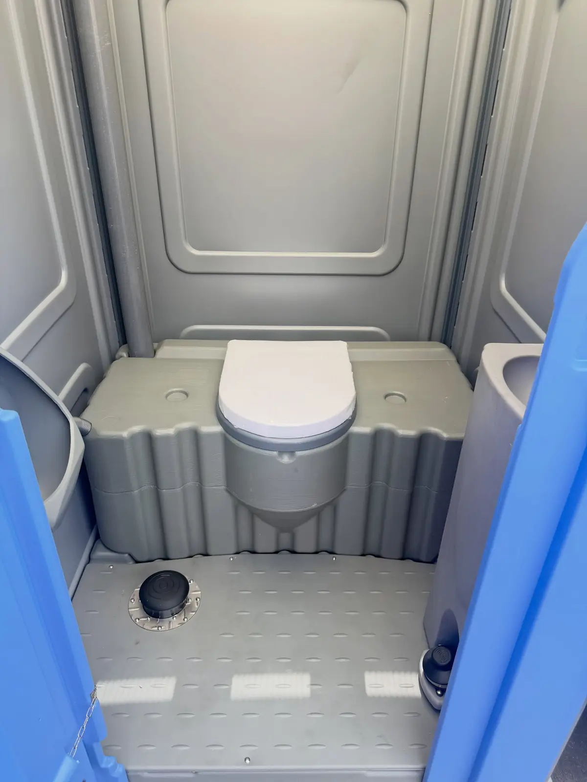 Clean floor inside a spacious portable restroom